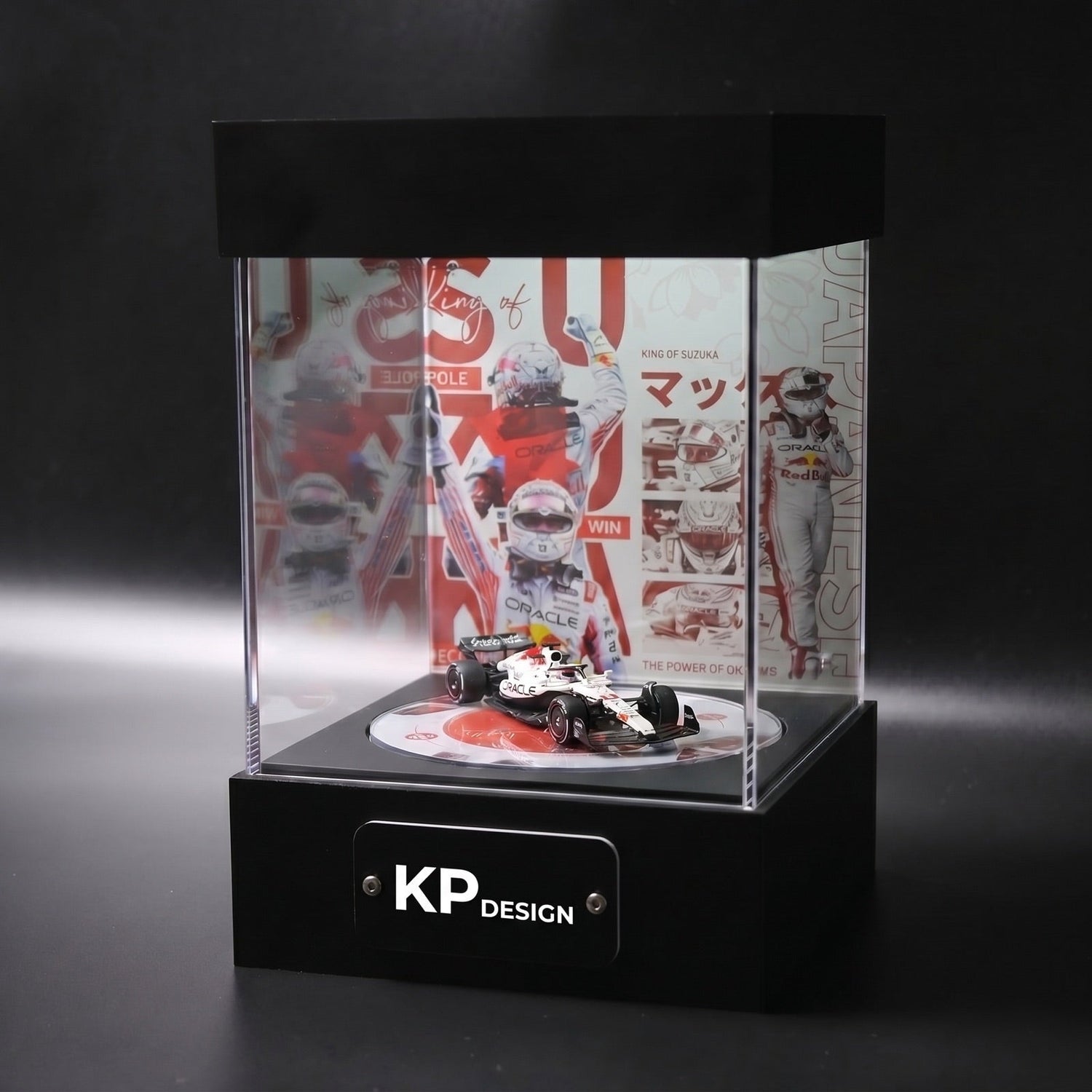 KP Design Rotating Stage displaying an F1 car with a themed Japanese Grand Prix livery panel, printed floor disc and KP Design nameplate