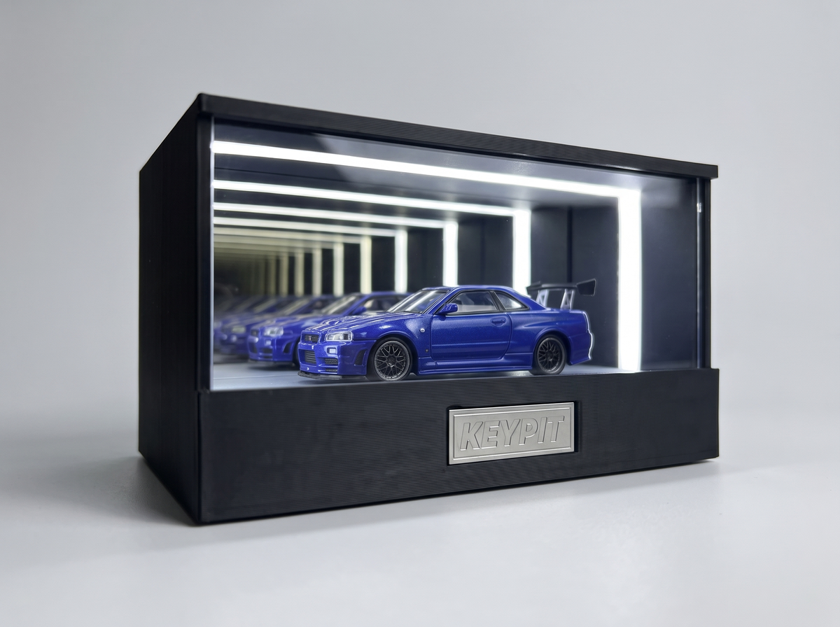 A sealed UV-free display case protecting a blue 1:64 diecast car