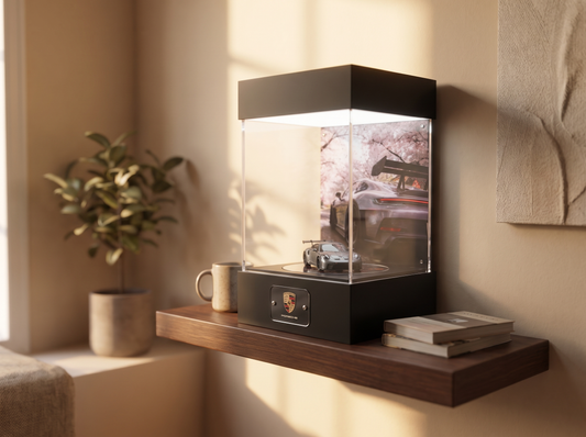 KP Design Infinity Garage display case with a single 1:64 diecast car on a small floating shelf in a compact apartment corner