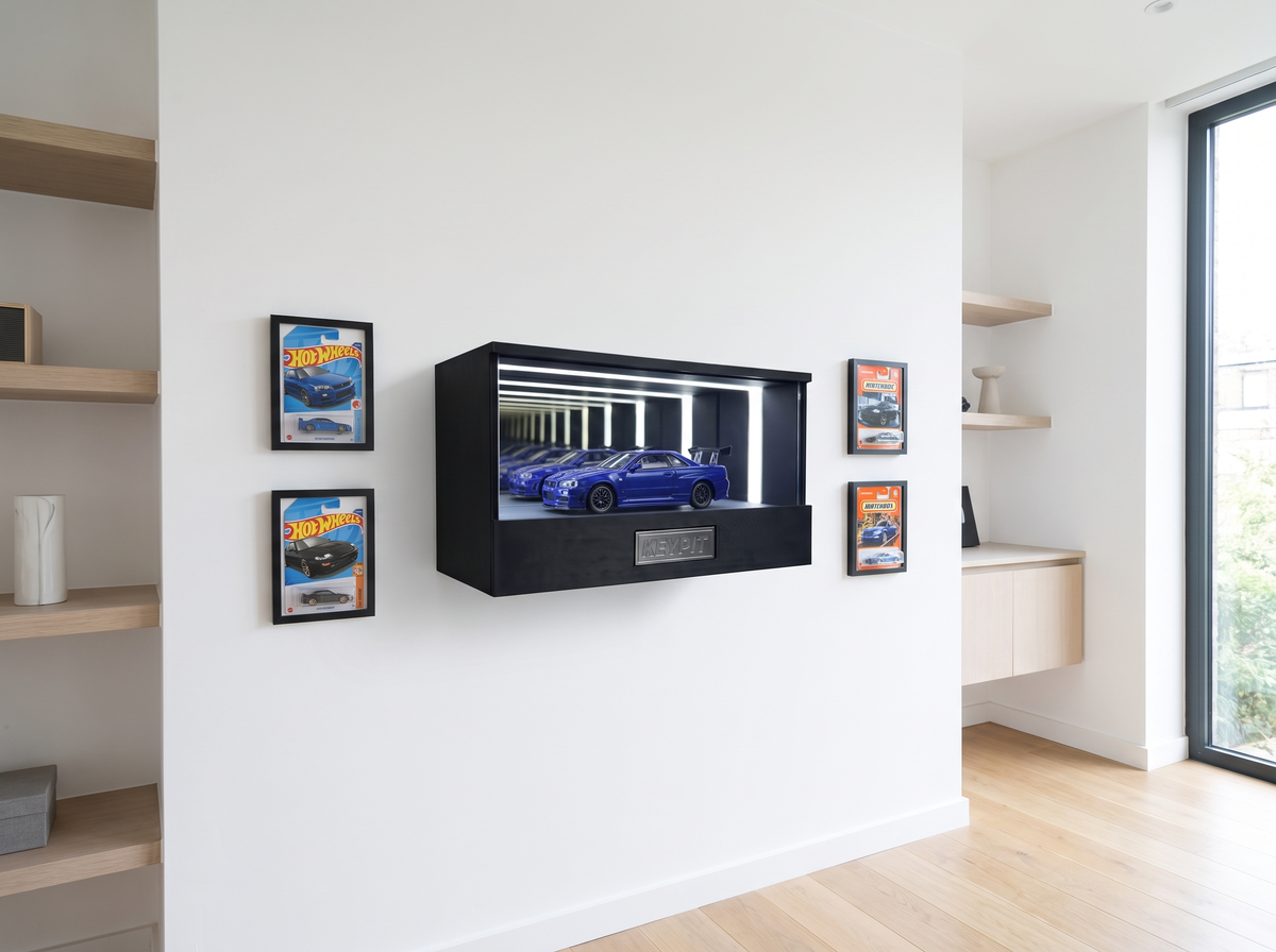 A wall-mounted lit display case as the centrepiece of a diecast display wall