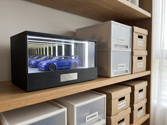 A single displayed hero piece on a shelf beside labelled storage boxes holding the rest of a collection