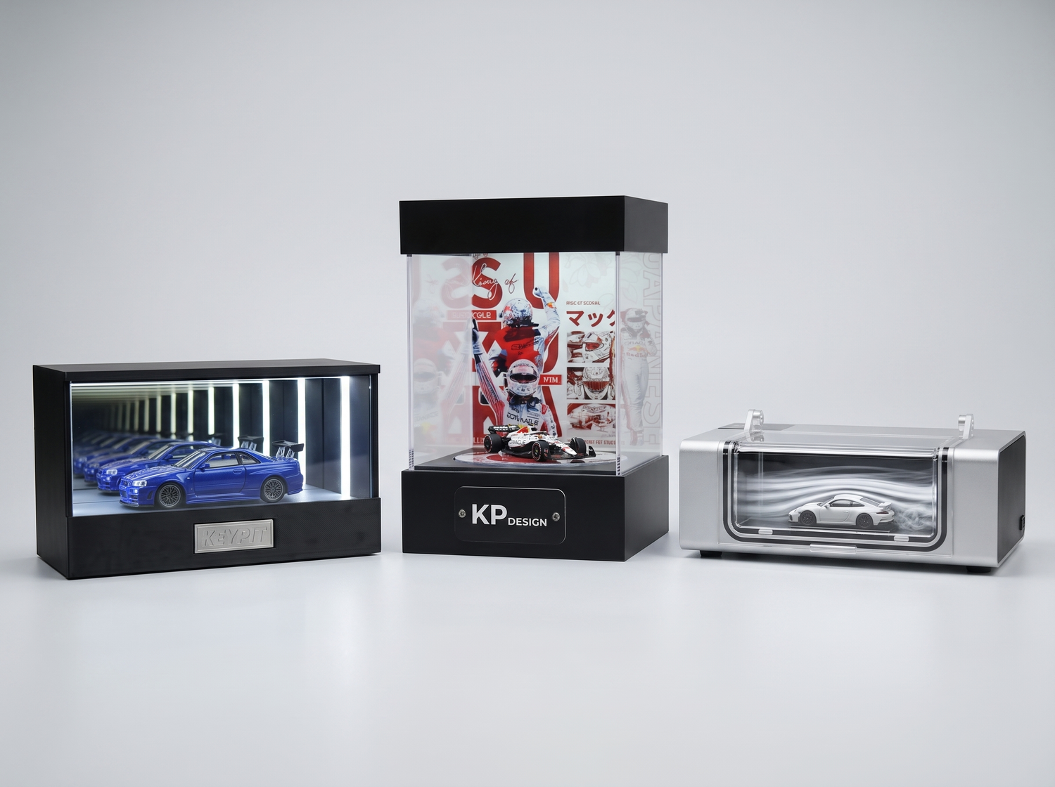 KP Design Infinity Garage, Rotating Stage and WindChaser displays side by side for comparison