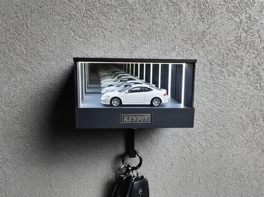 A white 1:64 diecast car with clean white paint under UV-free cool white lighting