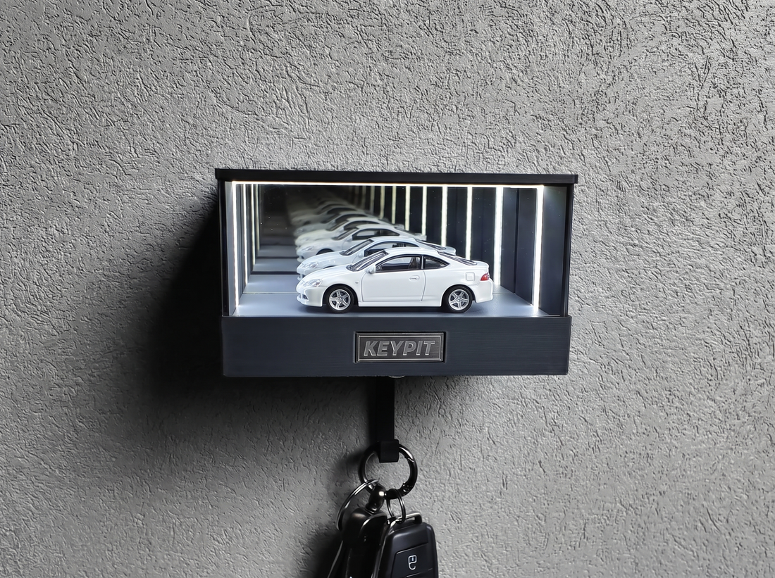 A white 1:64 diecast car with clean white paint displayed under UV-free cool white lighting