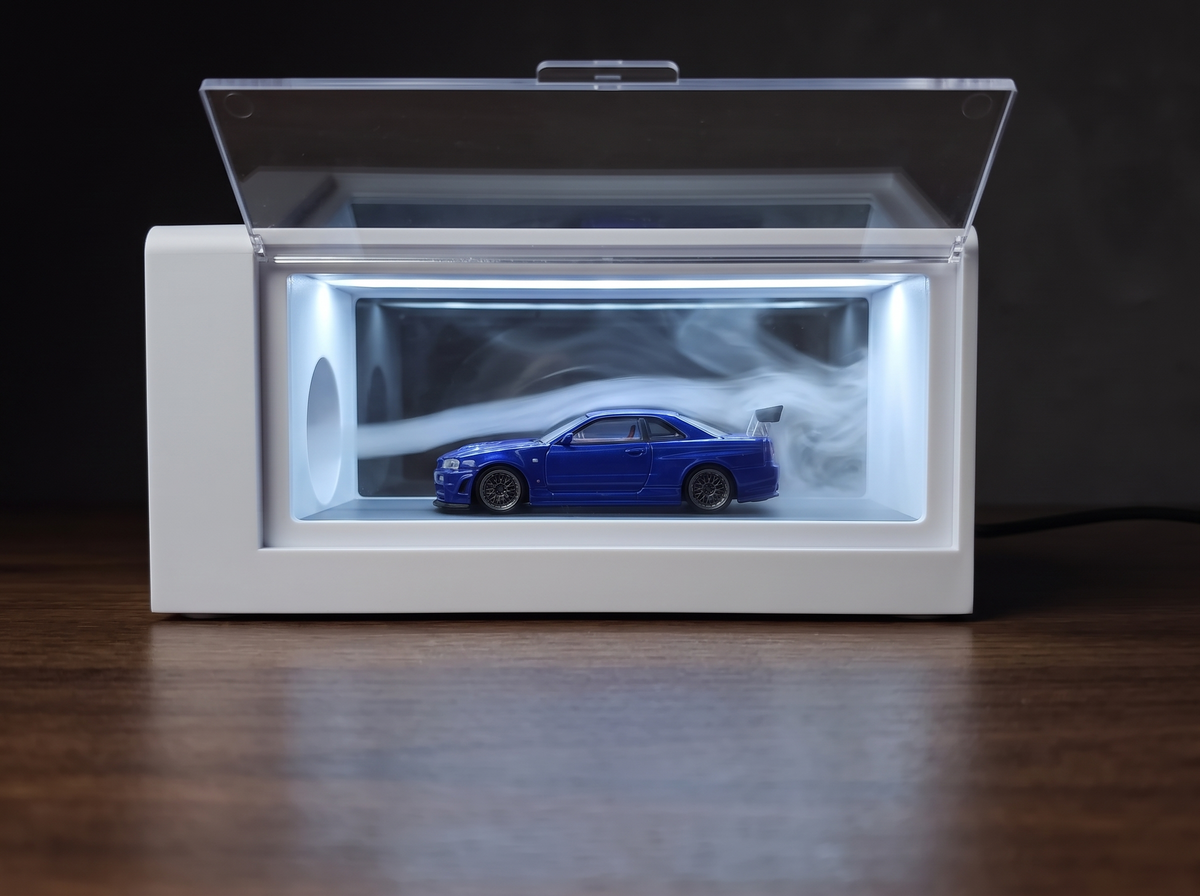 A blue 1:64 diecast car photographed under even lighting