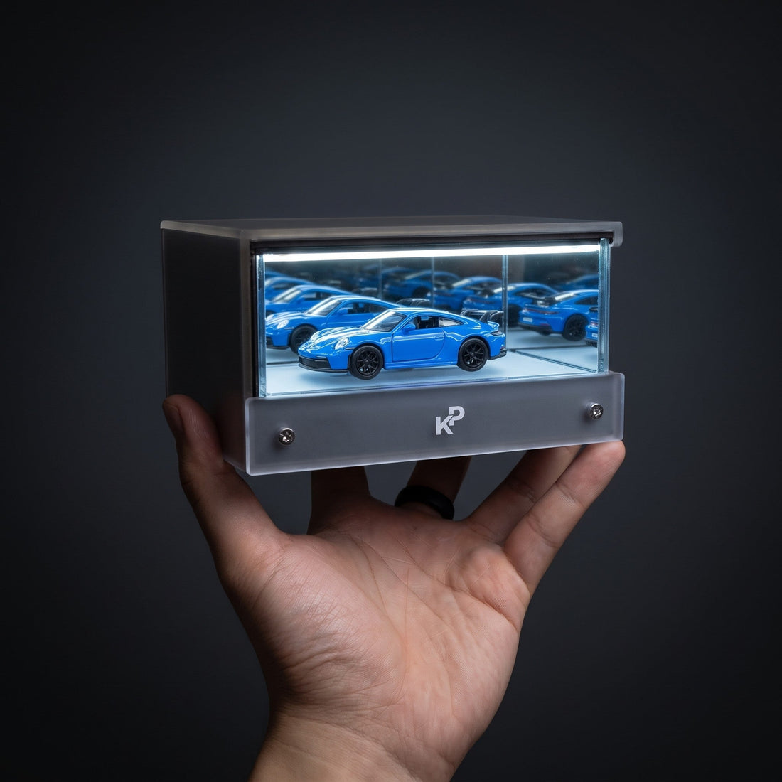 Infinity Garage 2nd Gen held in a hand for scale