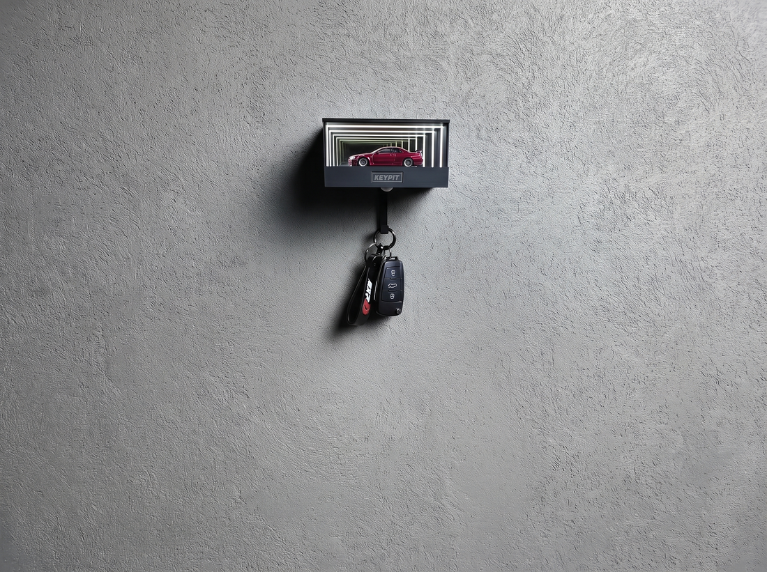 A lit display case holding one red 1:64 car mounted high on a wall, well above head height and out of reach