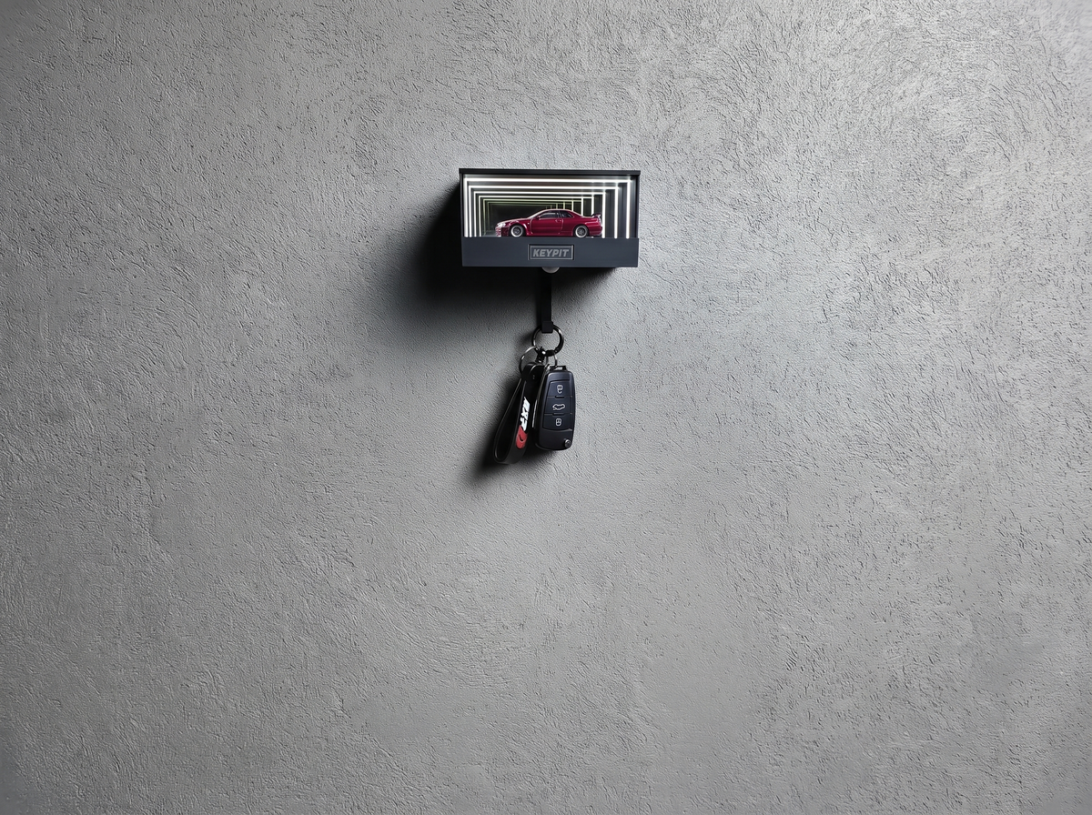 A lit display case holding one red 1:64 car mounted high on a wall, well above head height and out of reach
