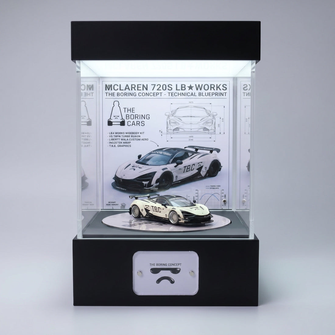 A white widebody McLaren 720S 1:64 in a lit KP Design Rotating Stage with a technical blueprint backdrop showing spec drawings and dimensions