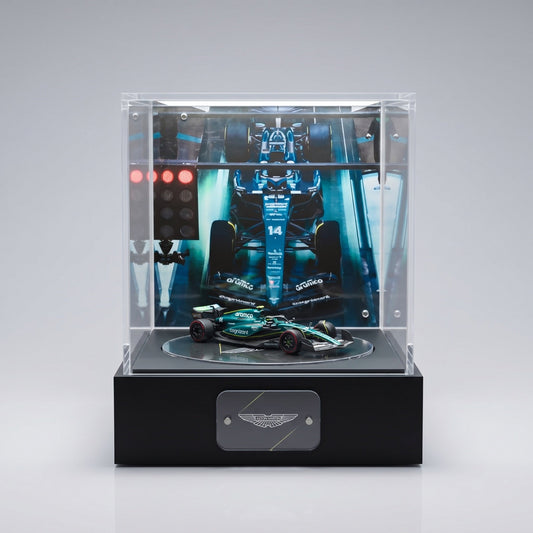 A lit infinity-mirror display case with a diecast car, showing the depth effect a true beam-splitter chamber produces