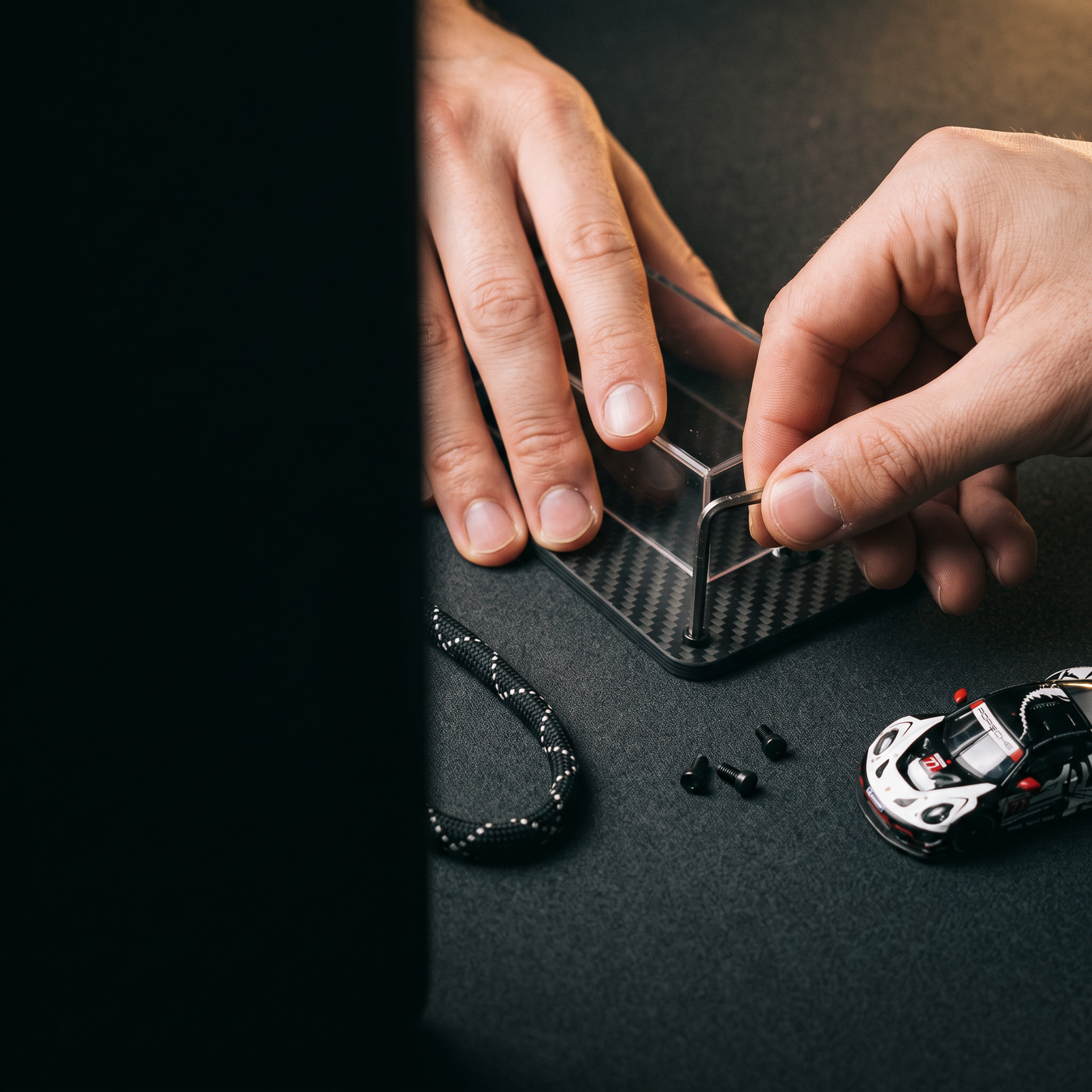 Hands opening the Pit Pass with the included hex key